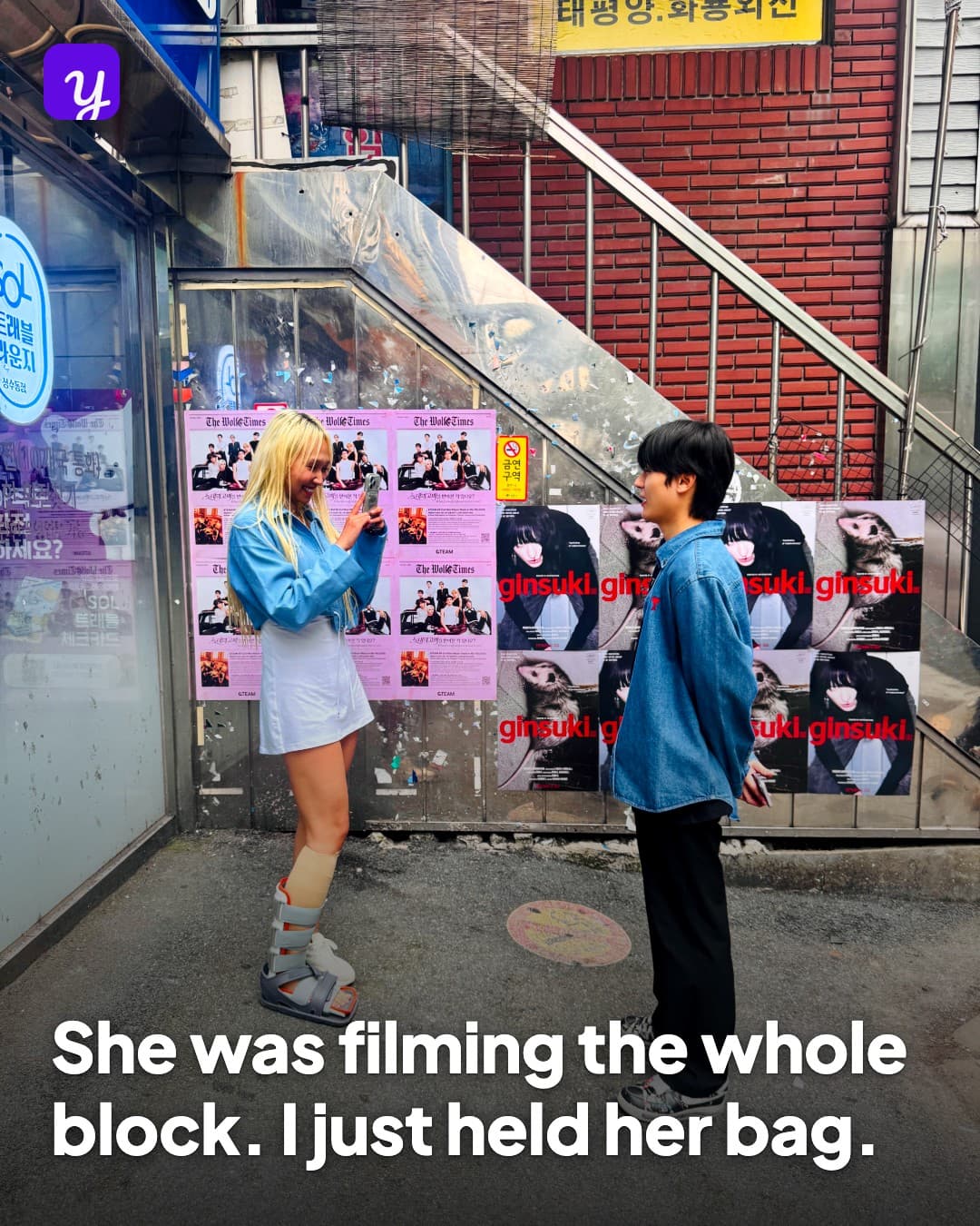 She was filming the whole block. I just held her bag.