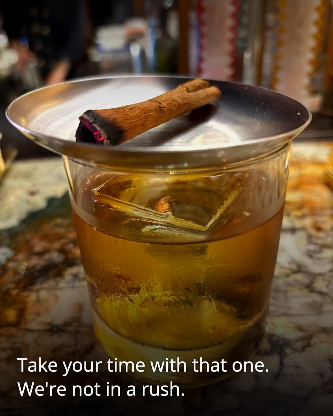 PUSSYFOOT SALON cocktail with cinnamon garnish